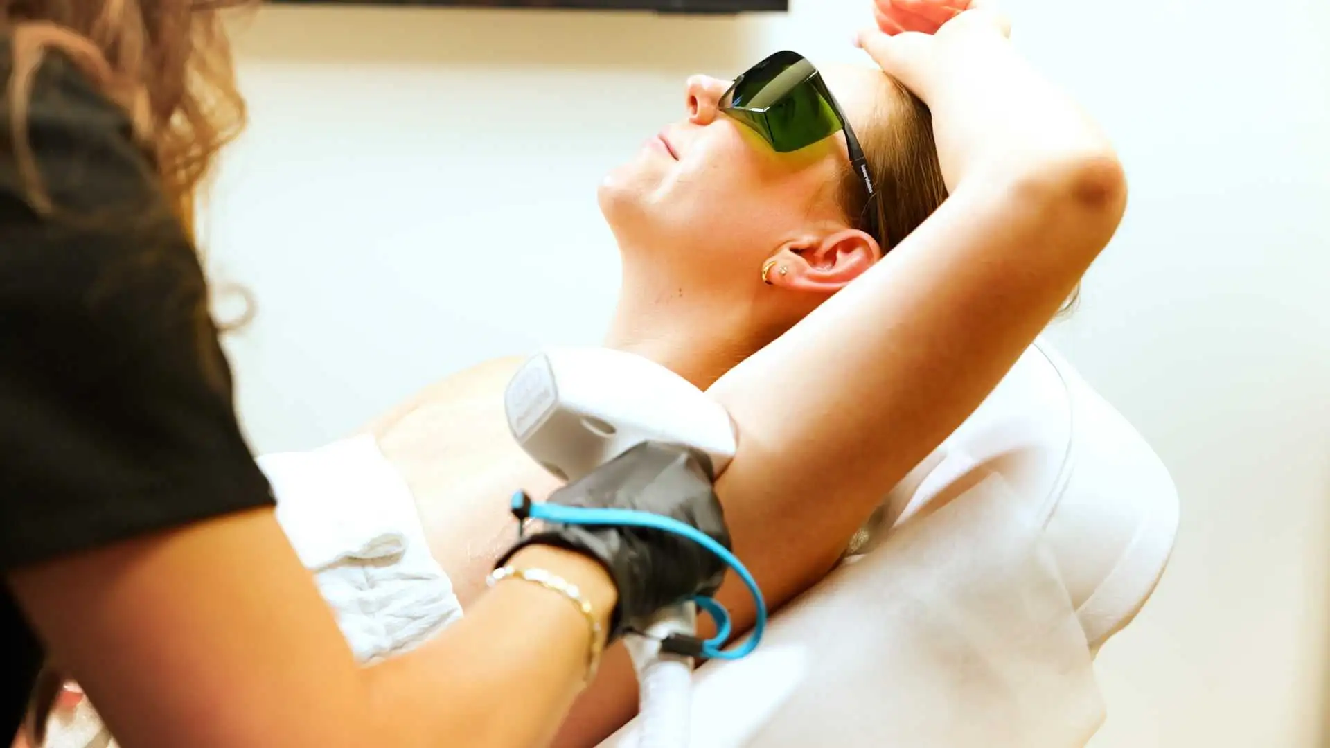 Laser hair removal Calgary professional treating underarm area with diode laser technology